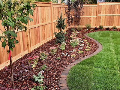 Rock landscaping and mulching in NWA by Ozark Outdoor Services